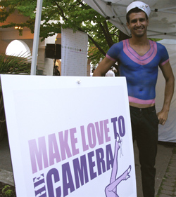 Sailor makes love to the camera at Hello Sailor fundraiser for Rethink Breast Cancer