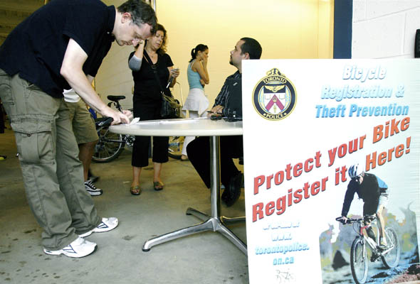 Owners of stolen bicycles register their bikes at Toronto Police open house