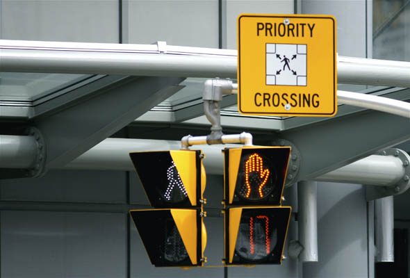 Priority Crossing sign at the new scramble pedestrian crossing at Yonge and Dundas in Toronto