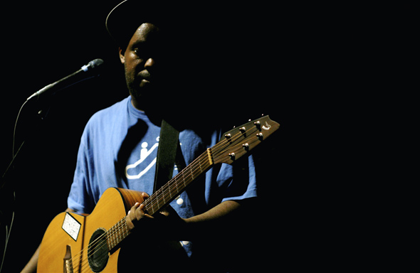 Shad performs with acoustic guitar at The Mod Club in Toronto