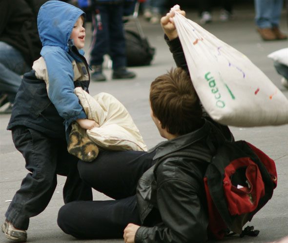 Kids having fun at the pillow fight at Yonge-Dundas Square in Toronto 2009