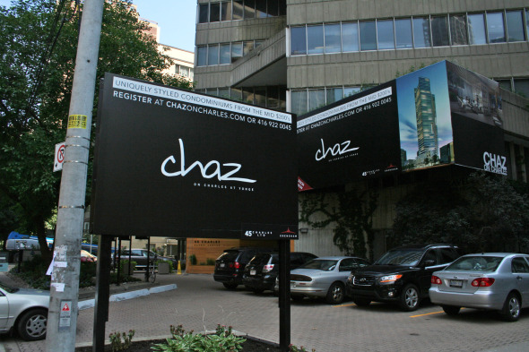 Chaz signs outside of 45 Charles Street East